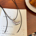 Silver Metal Croissant Pendant Black Cord Necklace view 6
