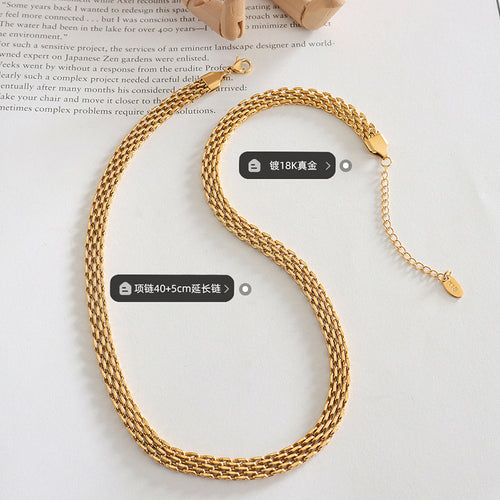 Gold woven mesh necklace flat lay with plating and length labels