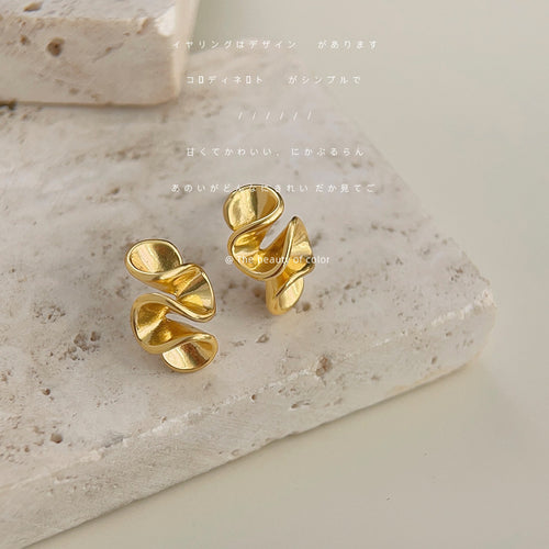 Gold-tone double-layer curled sculptural studs in the first product display.