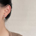 Silver Ribbon Bow Drop Earrings With Lace-Up Stud Top view 2
