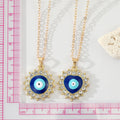 Gold Tone Crystal Halo Round and Heart Evil Eye Necklaces view 2
