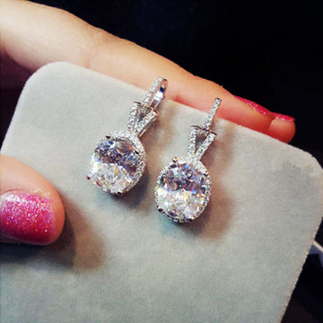 Silver Tone Pear Drop Earrings with Clear Stone Halos