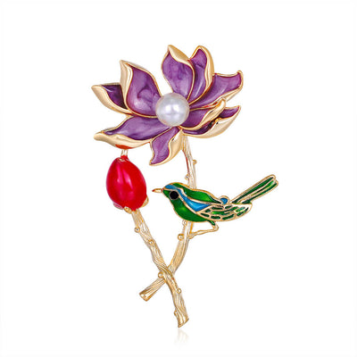Front product view of the lotus brooch pin in gold and purple