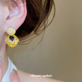 Gold Tone Geometric Drop Earrings With Pale Stone Centers view 4