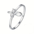 Silver Tone Bow Ring With Clear Floral Stone Center view 1