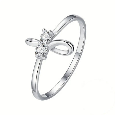 Alternate product view of silver tone bow ring with clear floral stone center