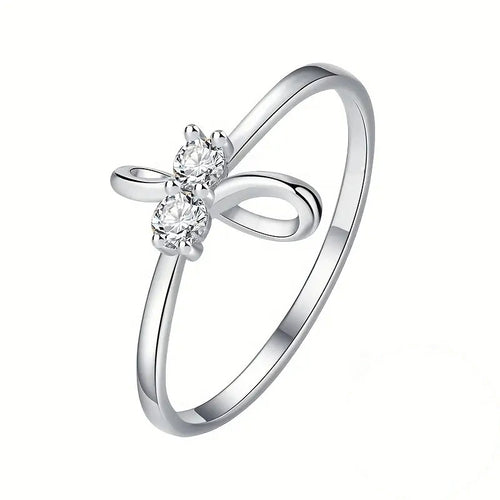 Alternate product view of silver tone bow ring with clear floral stone center