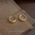 Gold Thick Huggie Hoop Earrings Polished Domed Band view 1
