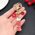 Red Fortune Tag Lucky Cat and Blossom Metal Keychain Set view 3