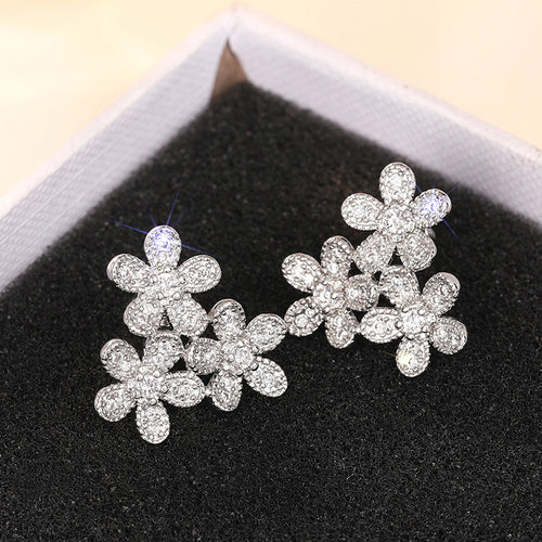 Pair of flower cluster studs in black jewelry box