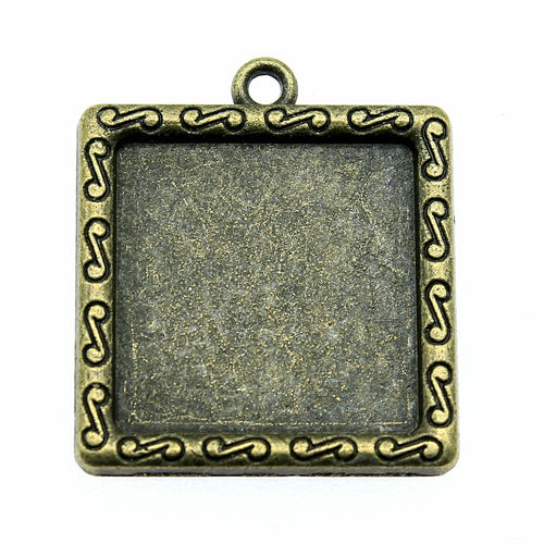 Close view of ornate square bezel pendant tray in antique bronze tone