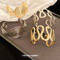 Spiral Disk And Organic Loop Open Cuffs In Gold Or Silver Tone view 3