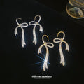 Crystal Bow Hook Earrings in Gold Tone or Silver Tone view 2