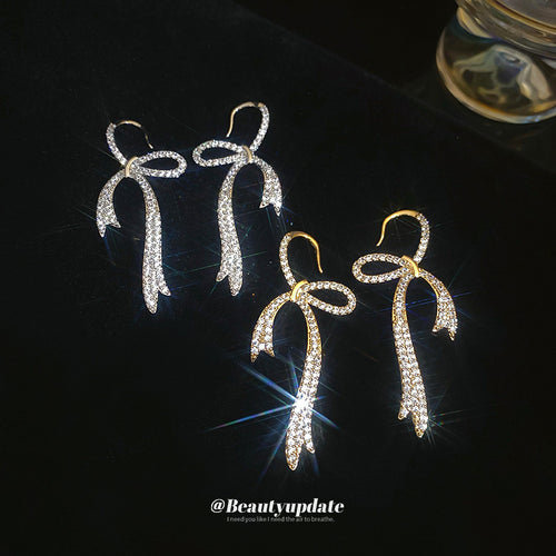 crystal bow hook earrings displayed from a second angle