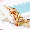 Gold Tone Revolver Keychain with Clear Crystal Grip Panels view 3