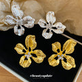 Open Hammered Flower Stud Earrings in Gold and Silver Tone view 1