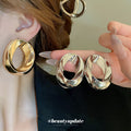 Sculptural Open Oval Stud Earrings in Gold and Silver Tones view 2
