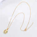 Gold Tone Artist Palette and Sweet Wrapper Pendant Necklaces view 5