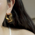 Irregular Wavy Hoop Earrings In Gold And Silver Tones view 2