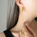 Gold Twisted Knot U-Shape Latch Hoop Earrings Pair view 1