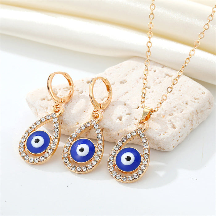 Gold Tone Crystal Teardrop Evil Eye Necklace and Huggie Earrings
