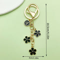 Gold-Tone Initial Letter Keychain With Three Flower Charms view 8