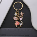 Four Pink and Blue Ocean Pearl-Look Metal Keychain Designs view 3