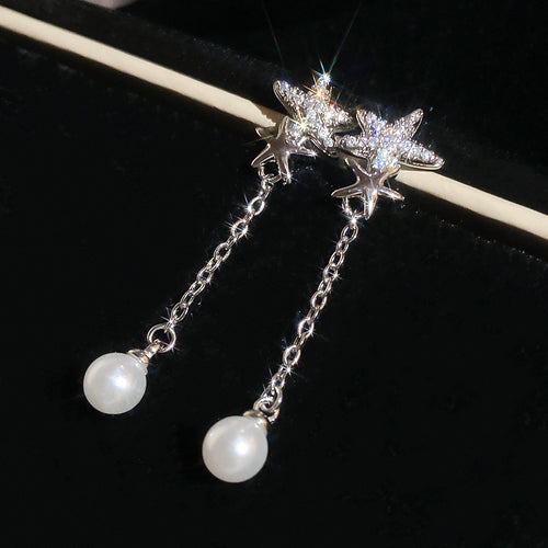 Crystal Star Stud Earrings with Long Pearl Chain Drops in arranged product view