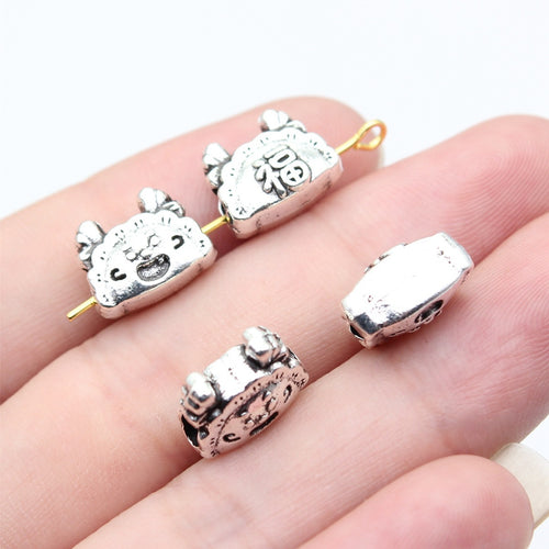 Lucky Bag Character Bead displayed in a hand for shape and finish detail