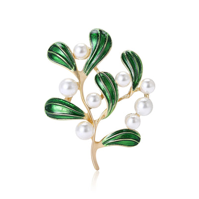 Enamel Leaf and Pearl Branch Brooch shown against a white display background