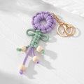 Gold Tone Woven Flower Doll Clip Keychains in Six Colors view 10