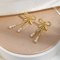 Gold Bow Triple Chain Pearl Look Long Stud Earrings view 1