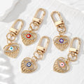 Gold Tone Rhinestone Open Heart Evil Eye Clip Keychains view 1