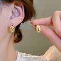 Polished Teardrop Stud Earrings In Gold And Silver view 4