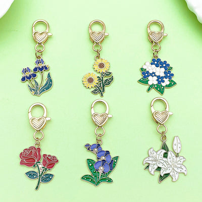 Image 1 showing rose, sunflower and flower keychains shown in the product image.