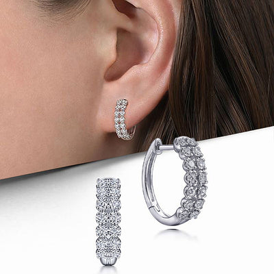 Silver pave huggie hoops shown on ear and as product close-ups