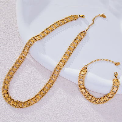 Gold multilayer starburst square link necklace and bracelet flat lay