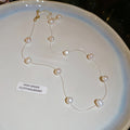 Gold Tone Floating Pearl Station Necklace with Polished Metal Tone Details view 6