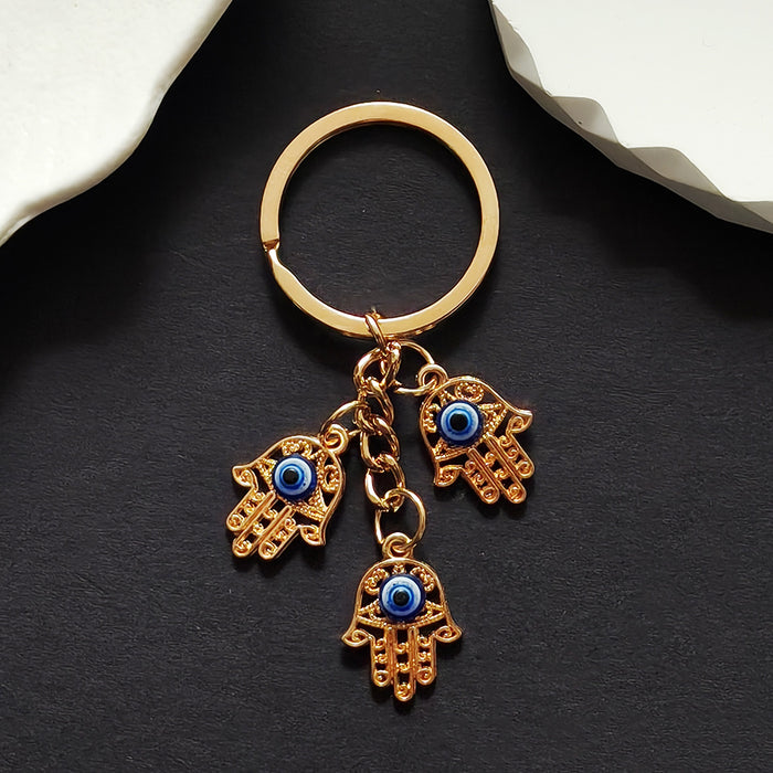 Triple Hamsa Hand Blue Evil Eye Keychain in Gold Tone Metal