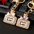 Jeweled Perfume Bottle Keychains with Pink or Purple Enamel Bows view 2