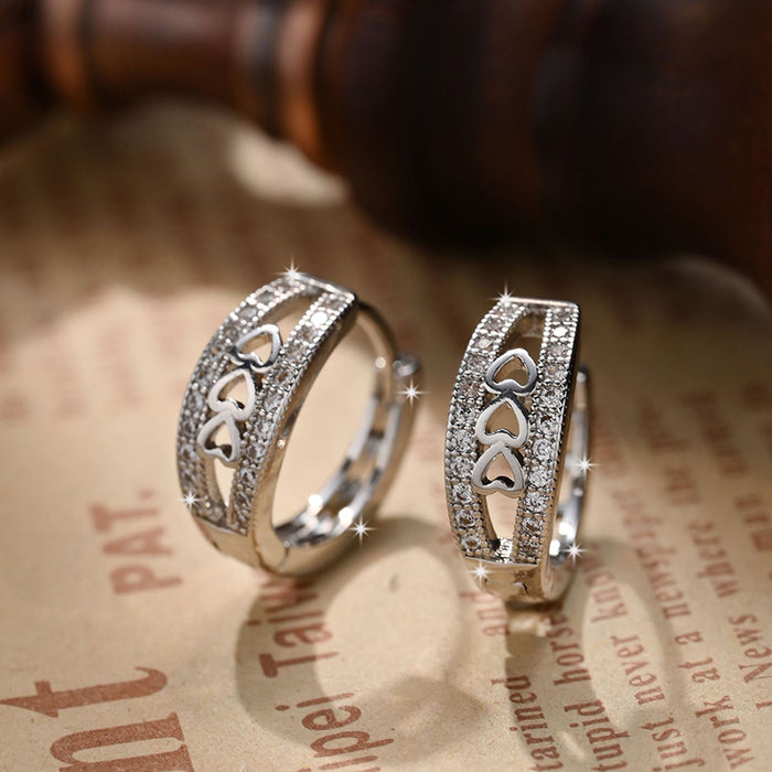 Silver Tone Heart Cutout Hoop Earrings with Clear Stones