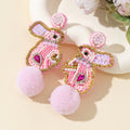 Pink Seed Bead Bunny Rabbit Earrings With Fluffy Pom Pom Tail view 1