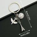 Antique Silver Airplane Globe and Eiffel Tower Travel Charm Keychain view 1