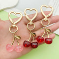 Heart Charm Keychains Featuring Pink Cherry Across 35 Pictured Variations view 3