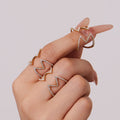 Crystal Cross and Leaf Band Open Rings in Gold Tone view 2