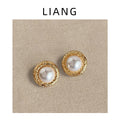 Gold Textured Round Pearl Stud Earrings Circular Rims view 1