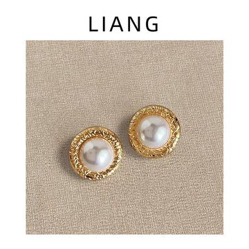 Gold Textured Round Pearl Stud Earrings Circular Rims