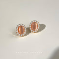 Gold Tone Peach Oval Stone White Pearl Like Halo Stud Earrings view 3