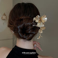 Gold Tone Flower Hair Pin With Textured Petals And Hanging Leaves view 1