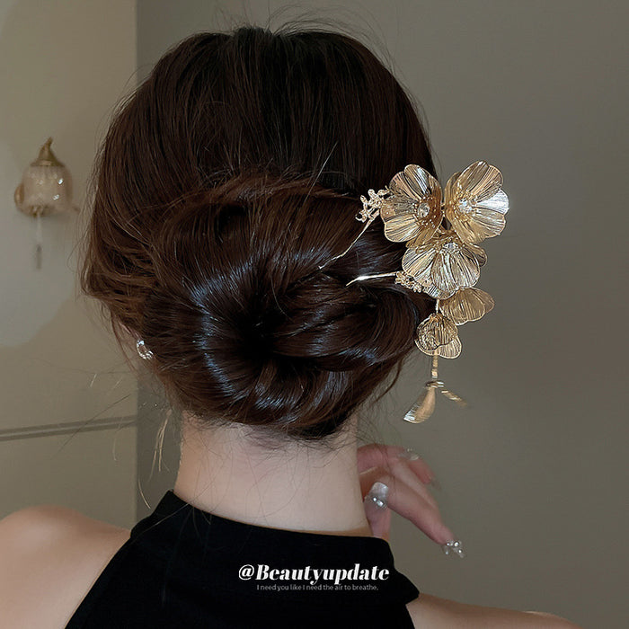 Gold Tone Flower Hair Pin With Textured Petals And Hanging Leaves